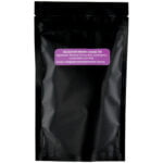 A black bag of Relaxation Tea with a purple label designed for relaxation purposes.