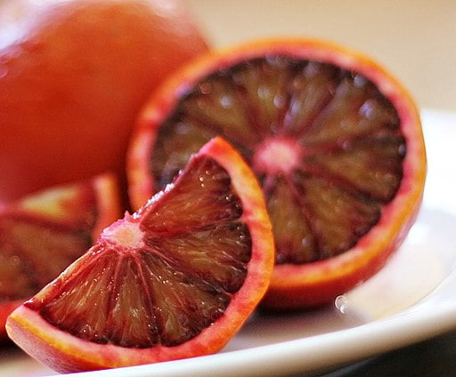 Blood Orange Goji Fragrance on a white plate.