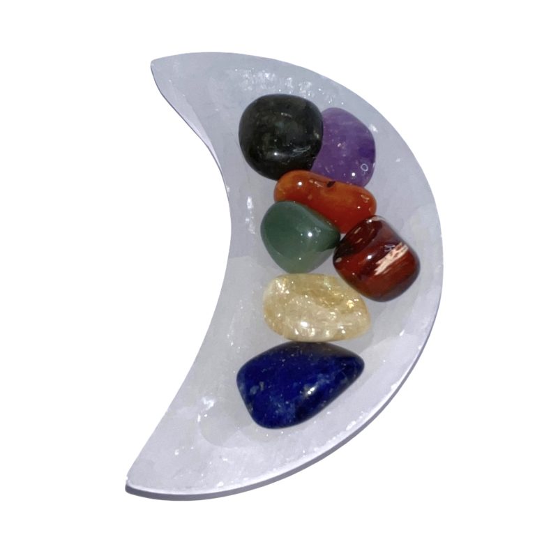 A Selenite Cleansing Bowl Moon Large adorned with different colored stones.