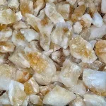 A close up of a pile of 50g AAA Grade Citrine Rough crystals.