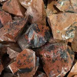 A pile of Mahogany Obsidian Rough 45g AAA Grade rocks.