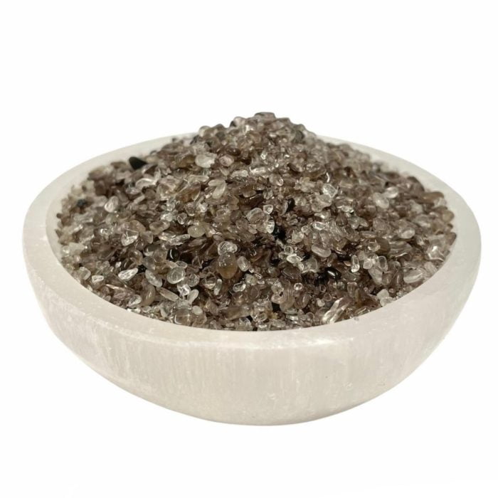 A bowl of salt in a Smokey Quartz Crystal Chips AA Grade crystal bowl.