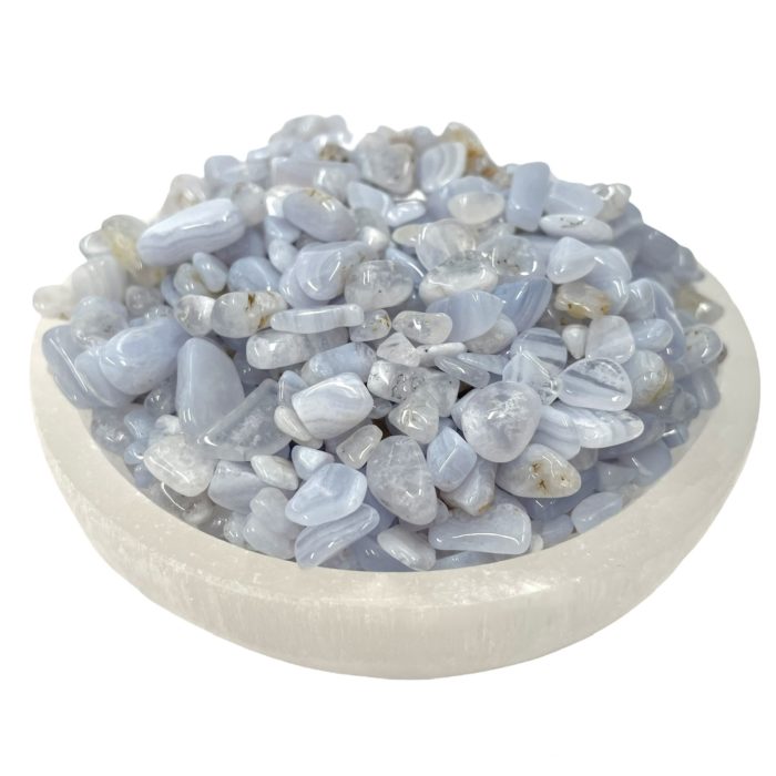 A bowl of Blue Lace Agate Crystal Chips AA Grade on a white background.