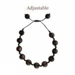 An adjustable black beaded bracelet with the words Smokey Quartz String Bracelet.