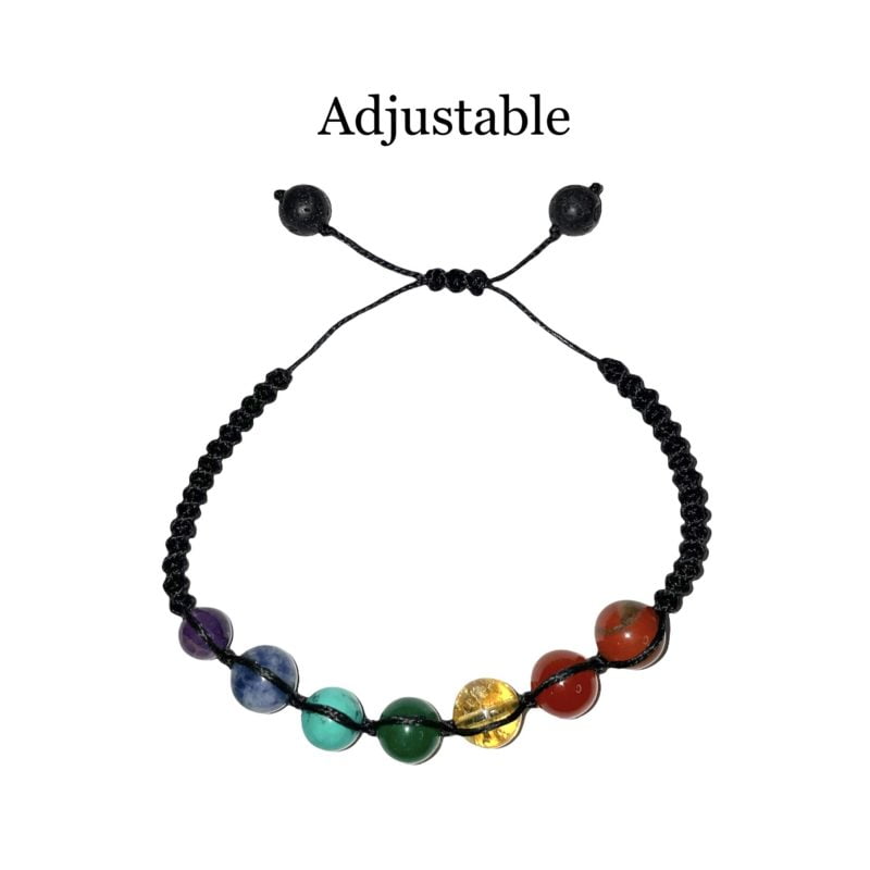An adjustable Chakra String Bracelet adorned with different colored stones.