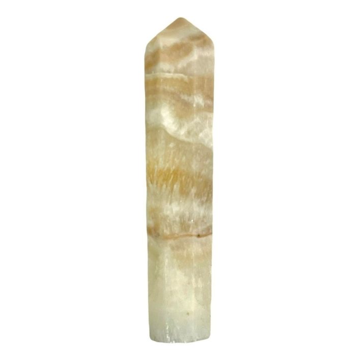 A yellow quartz point on a white background with a Caribbean Calcite Mini Tower.