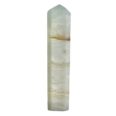 A tall piece of white jade on a white background, showcasing its exquisite Caribbean Calcite Mini Tower formation.