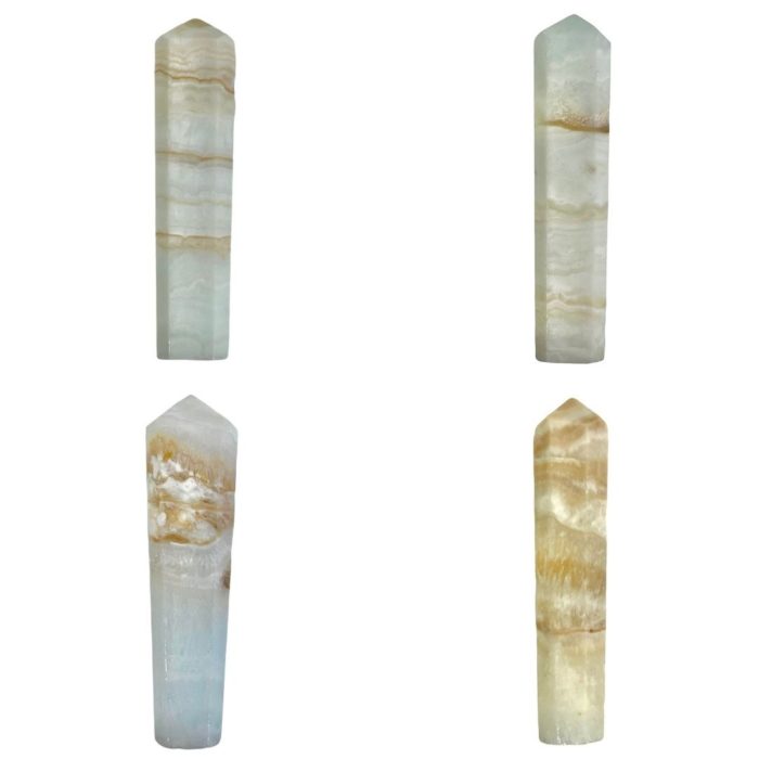 Four different types of quartz crystals, including Caribbean Calcite Mini Towers, showcased against a white background.