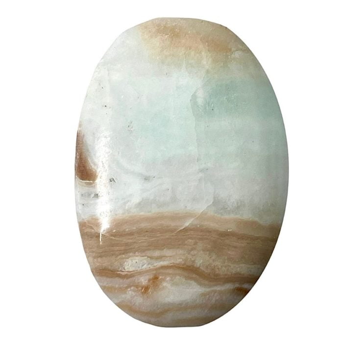 A Caribbean Calcite Palm Stone, round and with a white and brown color, reminiscent of the Caribbean.