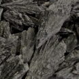 A close up image of a pile of black Kyanite Rough rocks.