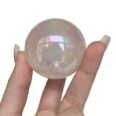aura quartz on rose quartz sphere