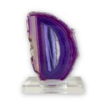 Purple Agate is a striking piece displayed on a clear stand.