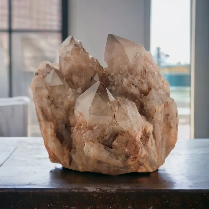 A Kundalini Citrine Cluster, sitting on top of a table.