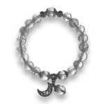A bracelet with a moon and star charm.